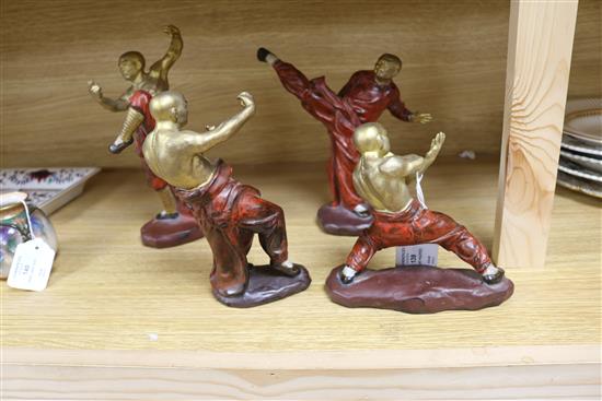 A set of four ceramic figures of boxers